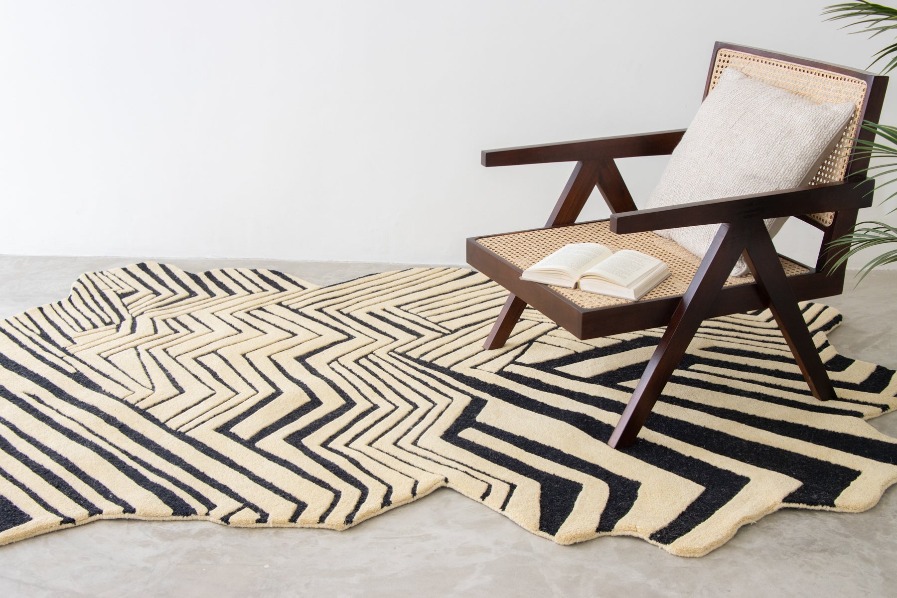 Wooden chair on black striped irregular rug | Beyond Rugs USA