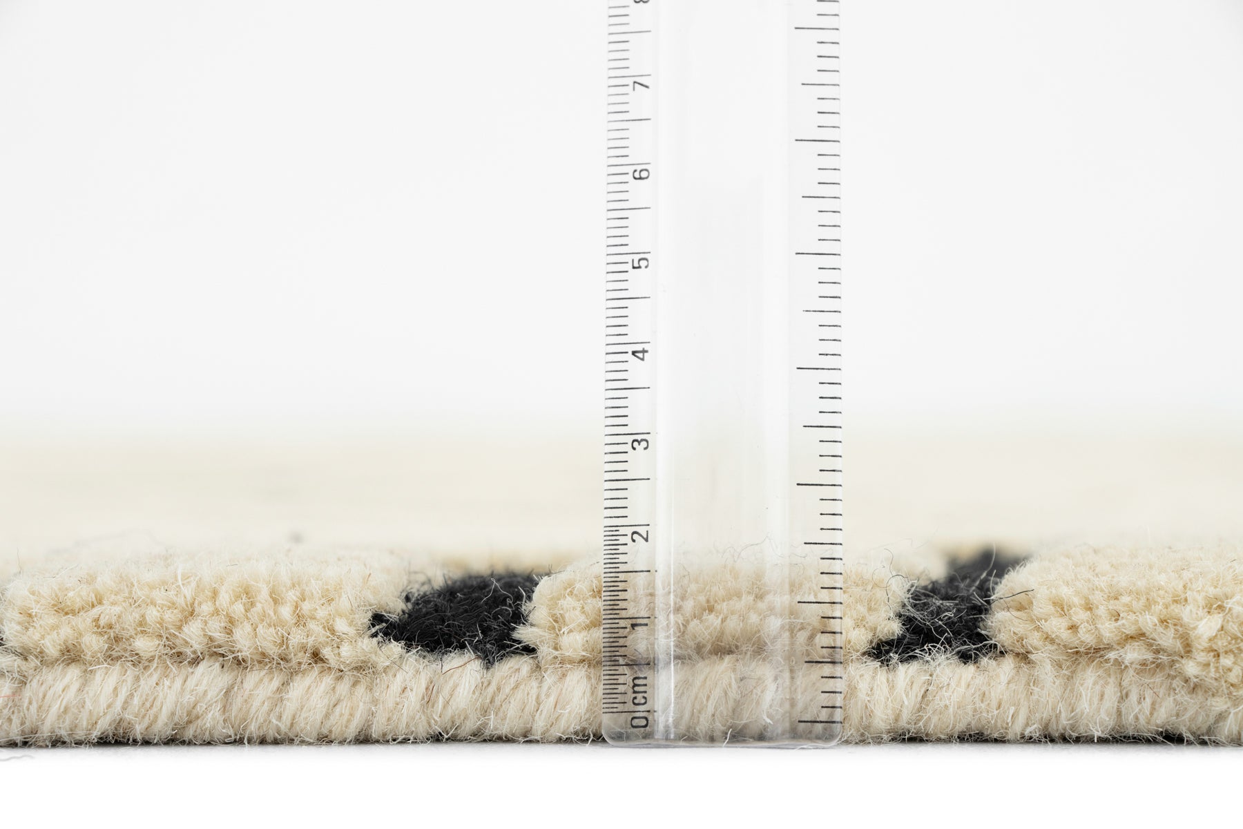 Corner rolled showing irregular rug grey backing | Beyond Rugs USA