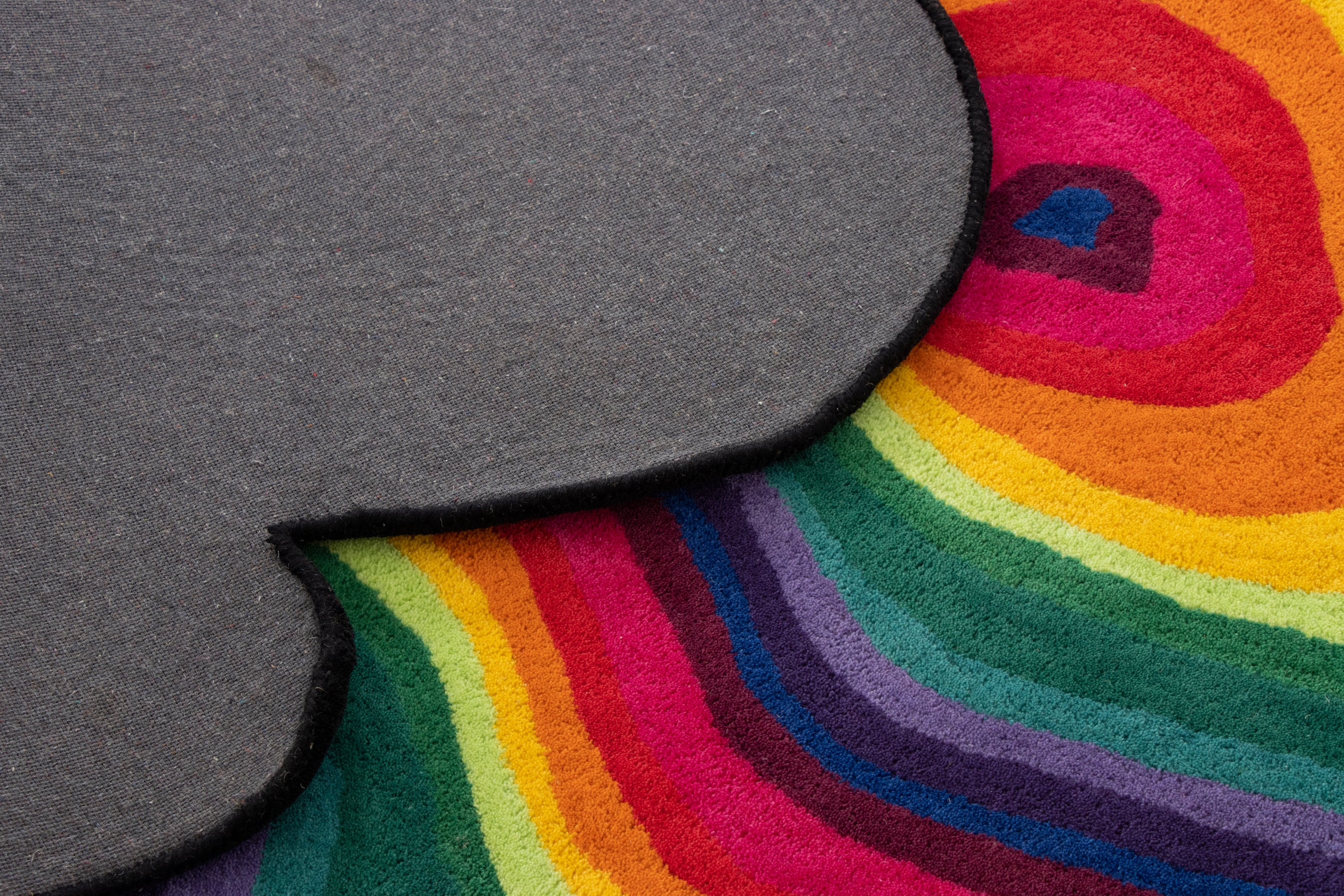 Paint Melts Rhapsody area rug color gradient close-up - rainbow spectrum transitions in irregular pattern
