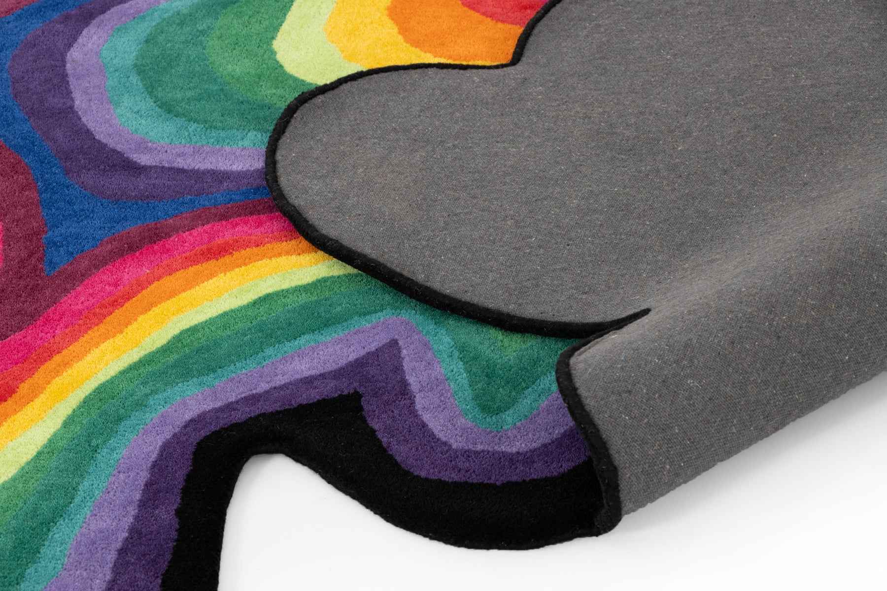 Paint Melts Rhapsody hand-tufted wool rug side angle view - irregular shaped multicolor area rug detail