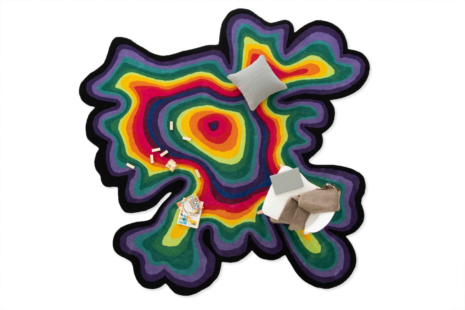 Paint Melts Rhapsody area rug styled with toy figures - lifestyle product shot showing scale and vibrant colors