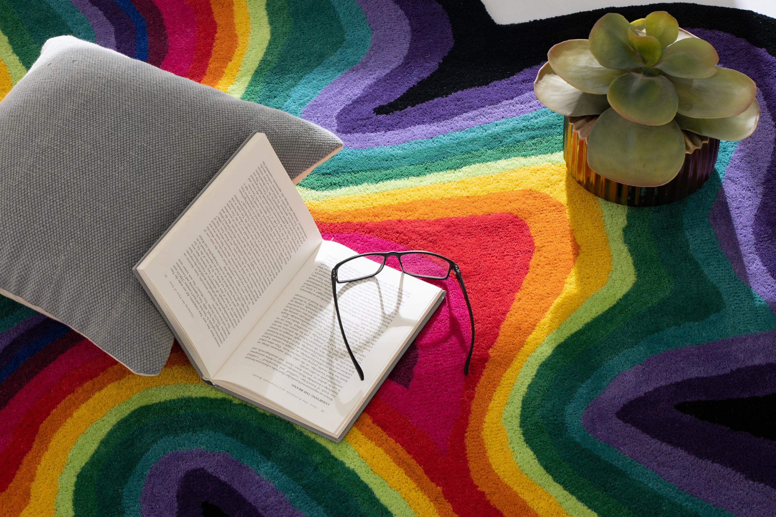 Paint Melts Rhapsody rug styled with colorful accessories - creative interior design lifestyle shot