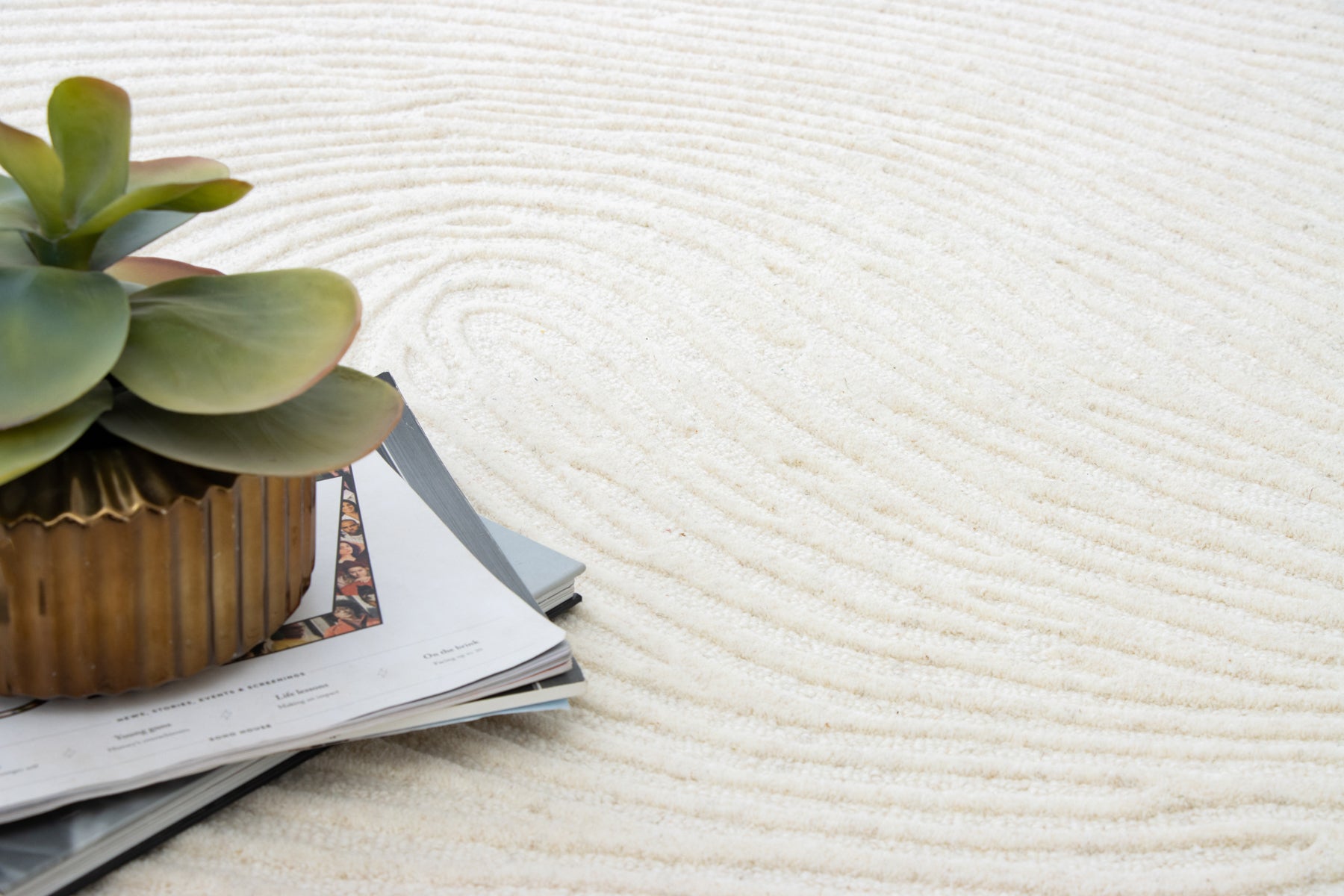 Open book on ivory irregular organic shaped rug | Beyond Rugs USA