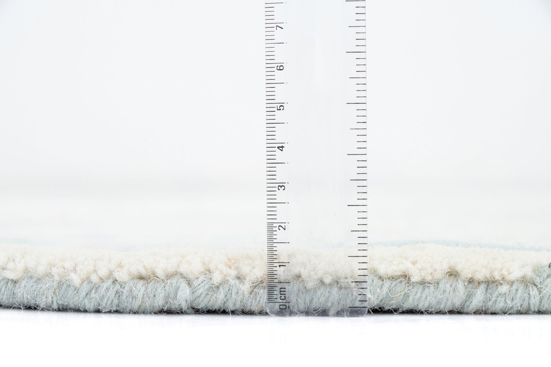 Edge detail blue cream irregular braidy wool rug | Beyond Rugs USA