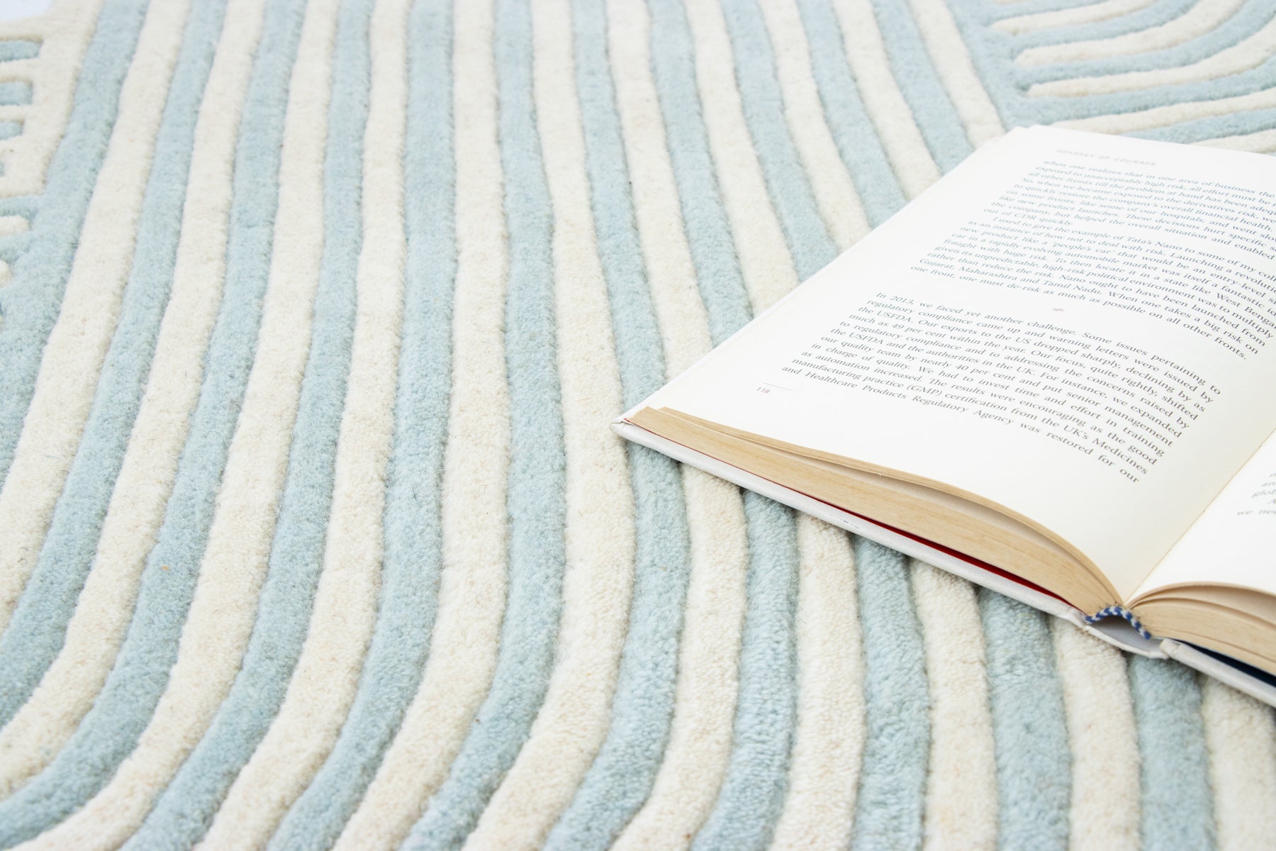 Grey cotton back of blue irregular braidy rug | Beyond Rugs USA