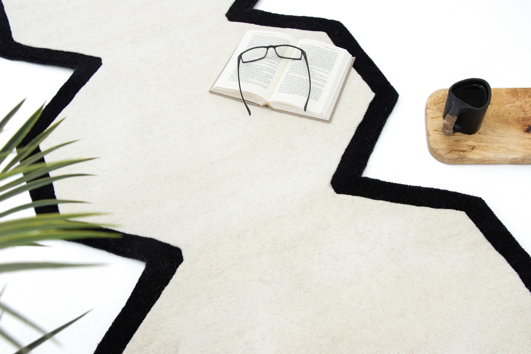 Chair on ivory black hexagon irregular wool rug | Beyond Rugs USA