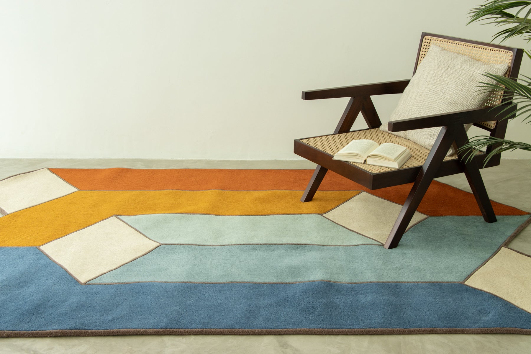 Contemporary geometric carpet in teal, mustard, and beige shades | Beyond Rugs