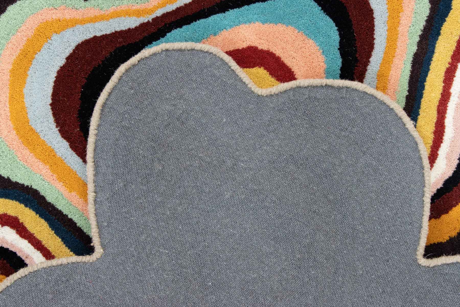 Paint Melts New Zealand wool rug showing abstract swirl pattern in bold contrast