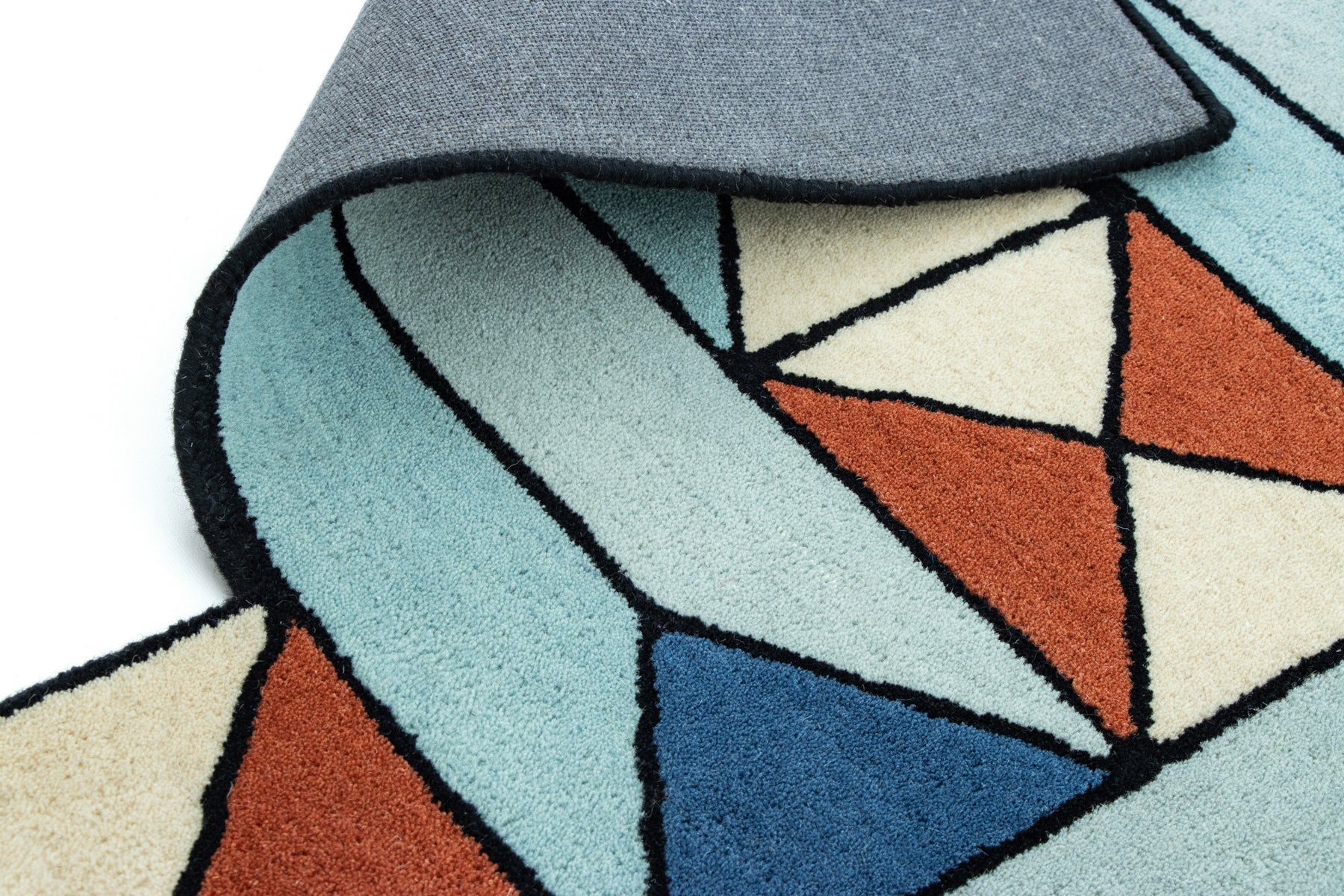 Artistic hand tufted geometric floor rug in teal, cream, and terracotta | Beyond Rugs