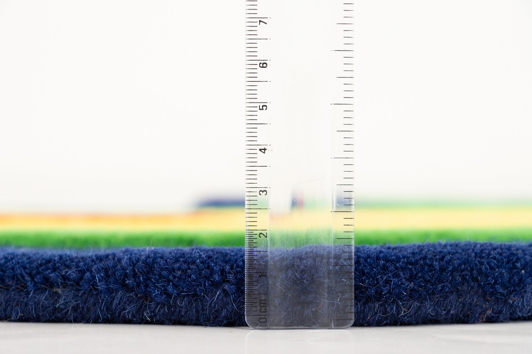 Amoeba Thermal rug side profile with ruler showing 12–15mm navy and green pile | Beyond Rugs