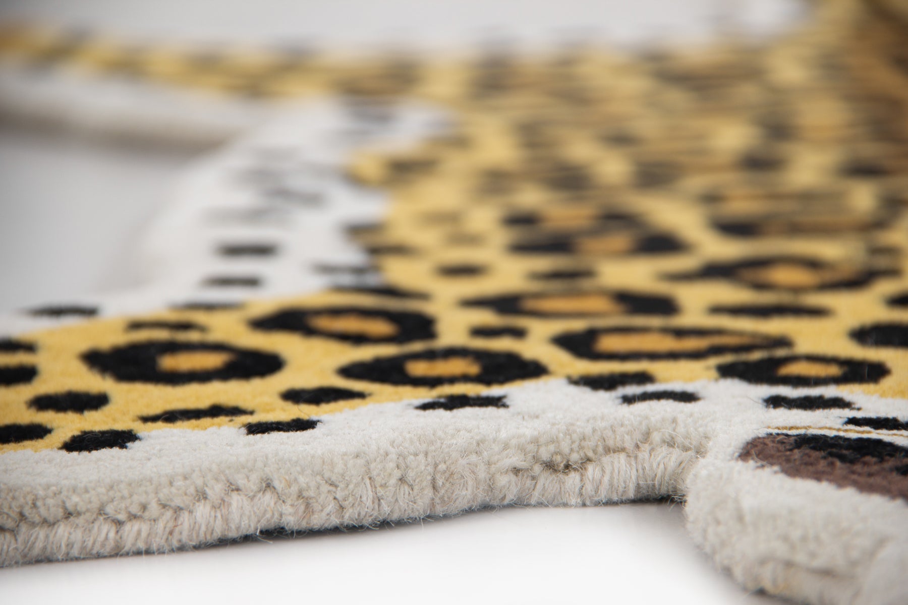 Flat lay view of classic leopard irregular rug showing full animal silhouette in yellow black | Beyond Rugs