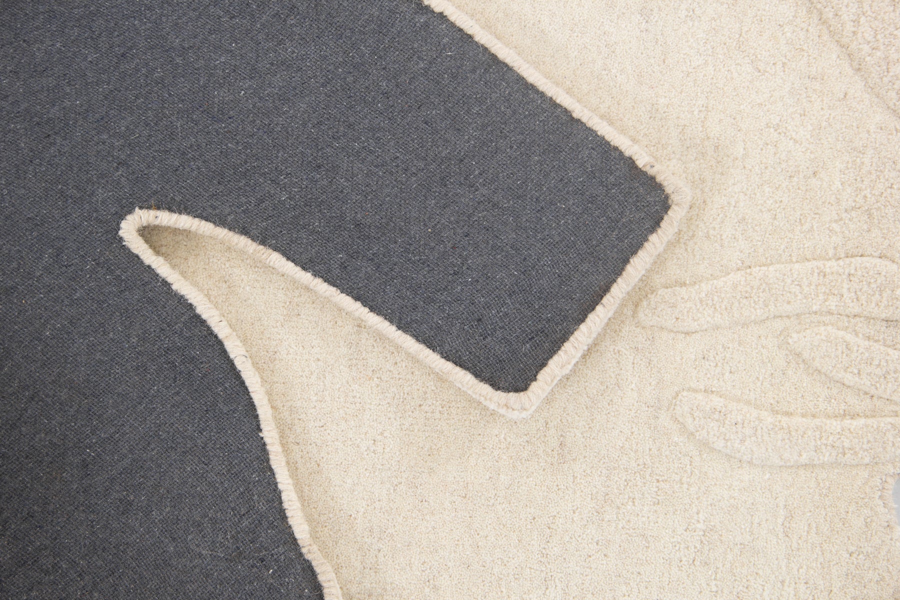Back view of arctic bear irregular rug showing grey canvas and cut-out bear silhouette | Beyond Rugs