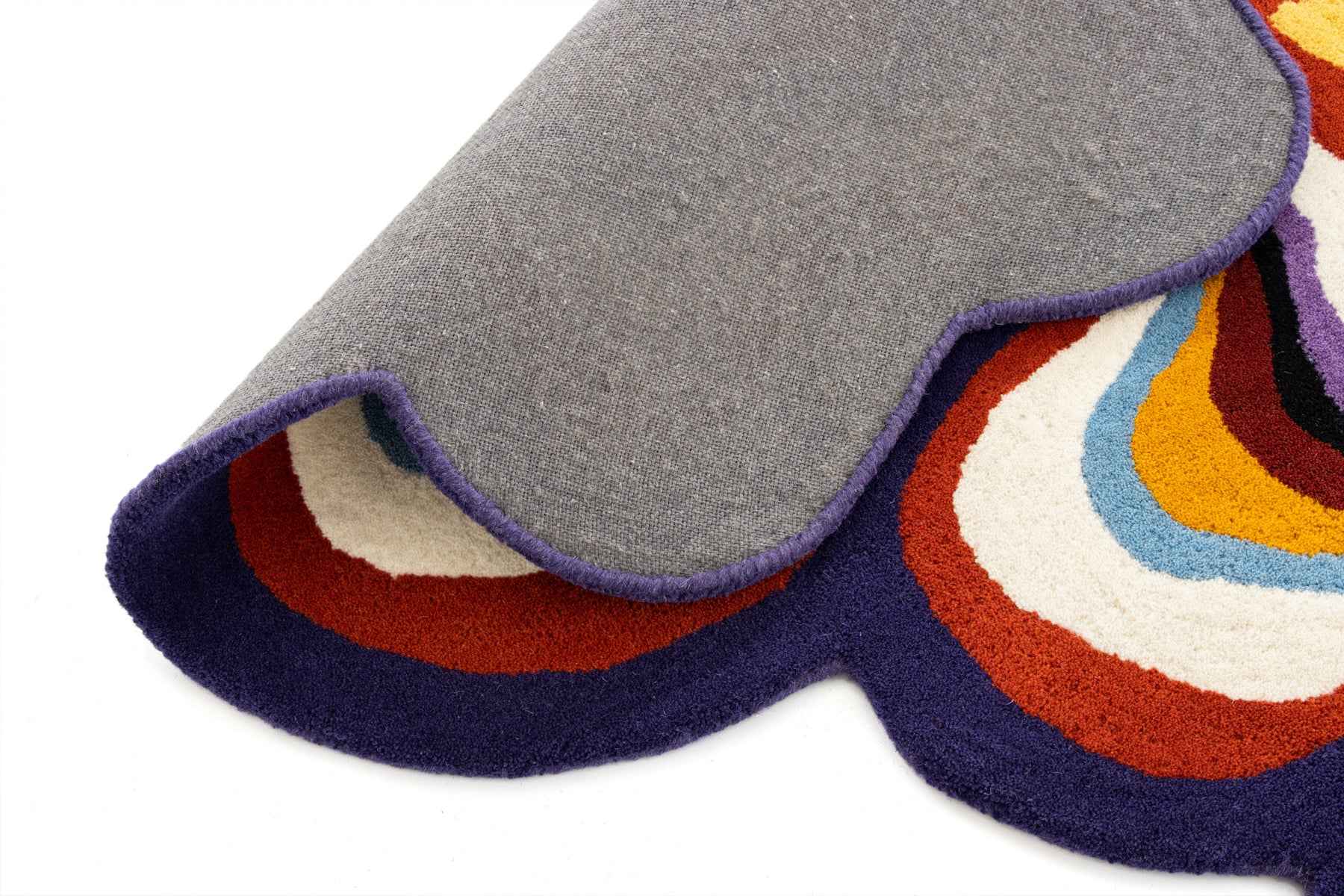 Paint Melts Radiant rug close-up detail showing colorful wavy pattern and hand-tufted texture