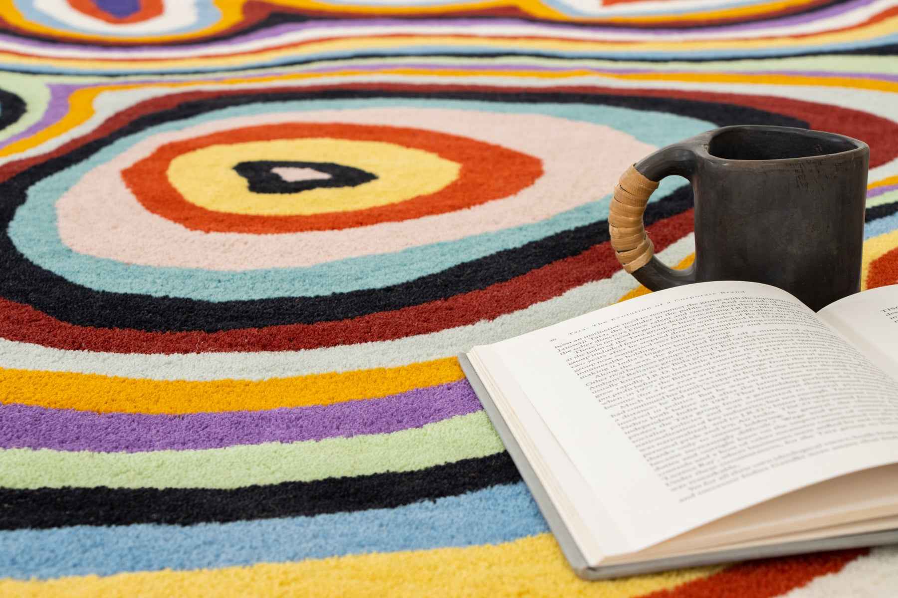 Pile height measurement of Paint Melts Radiant rug showing 12-15mm medium pile with measuring tape