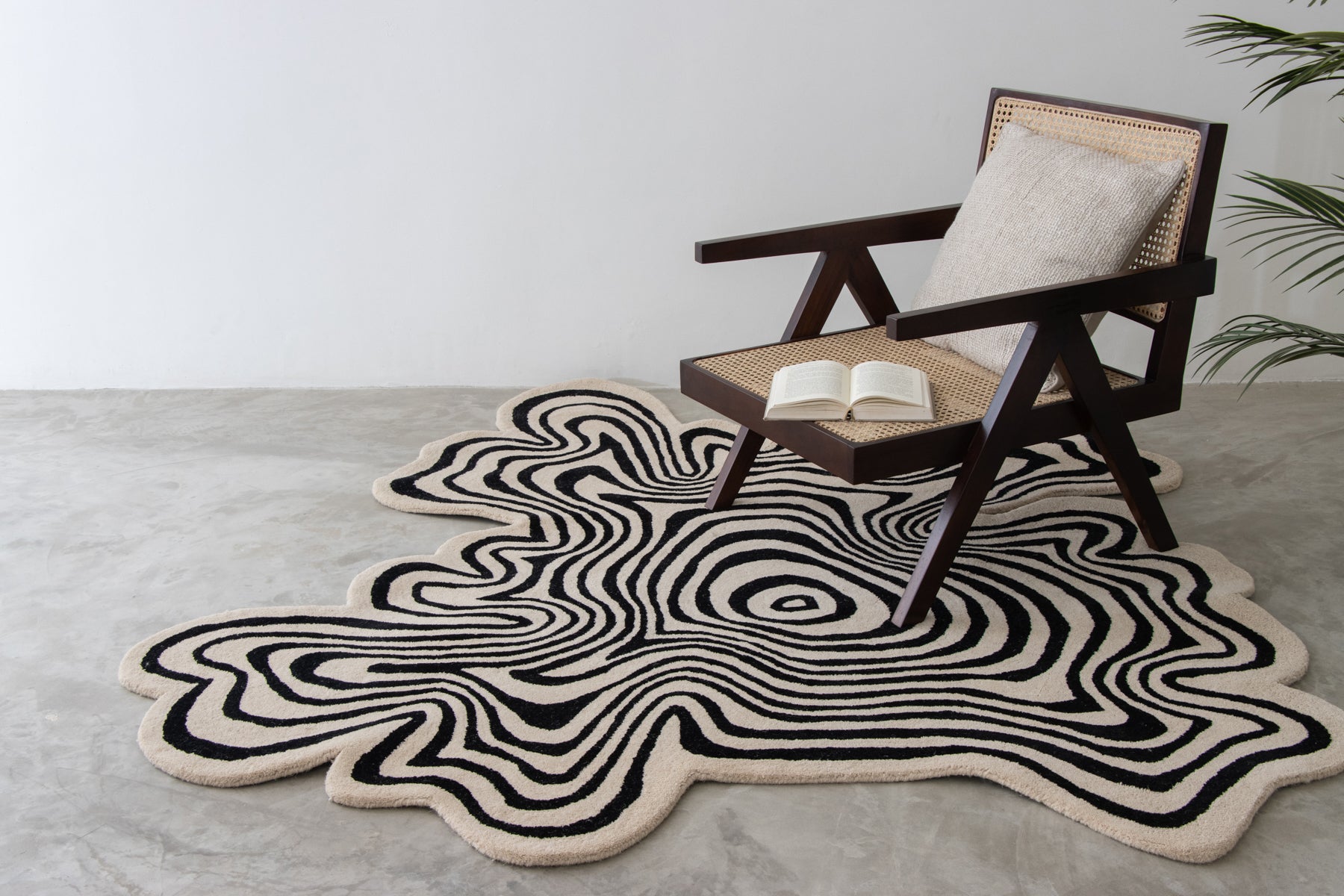 Contemporary irregular swirl carpet in bold black and ivory tones | Beyond Rugs